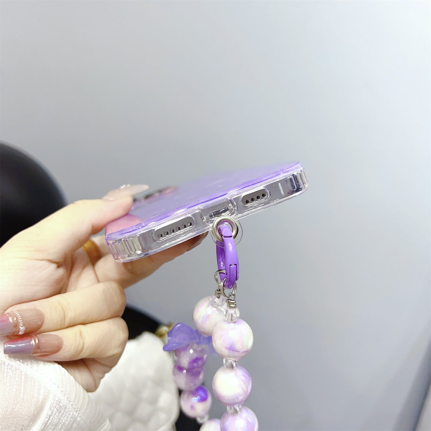 Uniqkart for iPhone 13 Pro Max 6.7 inch TPU+PC Phone Cover IMD Shell Pattern Anti-drop Case with Pearl Hand Chain - Light Purple Uniqkart for iPhone 13 Pro Max 6.7 inch TPU+PC Phone Cover IMD Shell Pattern Anti-drop Case with Pearl Hand Chain - Light Purple